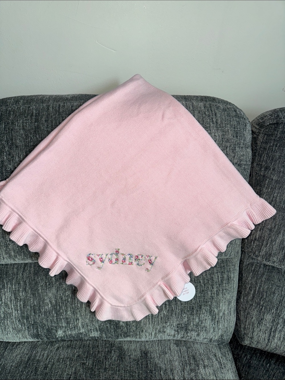 A SOFT IDEA KNITTED RUFFLE EDGE BLANKET